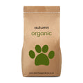 Brown paper bag with '100% Orgnaic autumn Lawn Feed' by The Relentless Gardener text and a green paw print on a white background