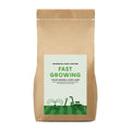 Brown paper bag with a label for fast-growing lawn seed by The Relentless Gardener on a white background