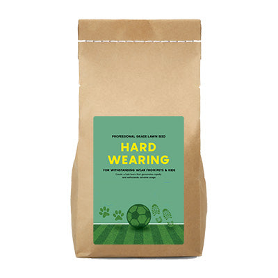 Kraft paper bag with a green 'Hard Wearing Grass Seed' from The Relentless Gardener on a white background