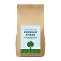 Kraft paper bag with 'Premium Shade Grass Seed' label on a white background
